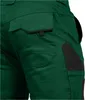A close-up view of the back pocket and side of green work pants with black accents. Produktbild-Vorschau