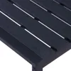 A close-up view of the slatted surface of a dark-colored outdoor bench. Náhled obrázku produktu