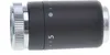 A close-up, side view of a black and silver radiator thermostat head against a white background. Podgląd zdjęcia produktu