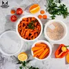 A flat lay of food items and food containers on a textured surface. Produktbild-Vorschau