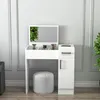 A white vanity table with a mirror and a stool in a room with light gray walls. Produktbild-Vorschau