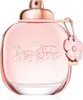 A close-up studio shot of a Coach Floral Eau de Parfum bottle. Voir les images du produit