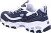 A side view of a navy and white Skechers sneaker. Produktbild-Vorschau