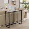 A console table with decorative items on top, placed in a living room setting next to a sofa. Podgląd zdjęcia produktu