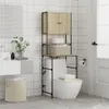 A bathroom scene with a toilet and a storage unit above it. Náhled obrázku produktu