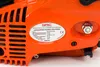 A close-up of an orange chainsaw with a label showing product information. Anteprima dell’immagine prodotto
