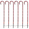Six illuminated candy cane garden stakes arranged in a row against a white background. Produktbild-Vorschau