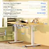 A height-adjustable desk with a wooden top and white legs, shown with a laptop, cup, and headphones. Produktbild-Vorschau