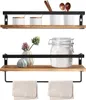 Two wooden shelves with black metal frames are displayed against a white background. The top shelf holds decorative jars and utensils, while the bottom shelf displays decorative items and has a towel bar underneath. Náhled obrázku produktu