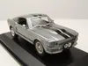 A silver 1967 Ford Shelby Mustang GT 500 Eleanor model car is displayed on a black stand against a light gray background. Produktbild-Vorschau