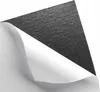 A close-up shot of a piece of black felt with a white backing, partially peeled back. Produktbild-Vorschau