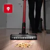 A person vacuuming a floor with spilled cereal. Voir les images du produit
