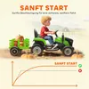 A child is riding a green toy tractor with a trailer full of pumpkins, with a graph showing acceleration. Náhľad obrázku produktu