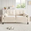 A beige sofa is shown in a well-lit room with a window in the background. Náhľad obrázku produktu