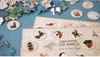 A close-up of a puzzle with various circular images of landmarks and animals, along with puzzle pieces scattered around. Anteprima dell’immagine prodotto
