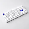 A white mechanical keyboard with blue accent keys on a white background. Voir les images du produit
