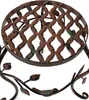 A close-up view of a decorative metal plant stand with a lattice top and floral accents. Produktbild-Vorschau