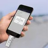 A hand holding a smartphone with a USB-C stick plugged into it, showing an app interface. Náhľad obrázku produktu