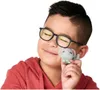 A young boy wearing glasses and a red hoodie holds a small, gray toy mouse up to his face, smiling. Náhľad obrázku produktu