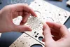 A close-up shot of hands assembling a wooden puzzle piece. Náhled obrázku produktu