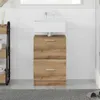 A bathroom vanity with a sink and two drawers, set against a tiled wall. Produktbild-Vorschau