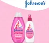 Two Johnson's products, a shampoo and a conditioner spray, are displayed against a pink background with a subtle pattern. The Johnson's logo is prominently featured at the top. Produktbild-Vorschau