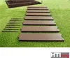 Brown garden bed components laid out on artificial grass. Produktbild-Vorschau