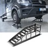A van is raised on car ramps in a workshop or garage. Podgląd zdjęcia produktu