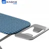 A close-up view of an ironing board with a blue patterned cover and a silver iron rest. Náhled obrázku produktu