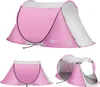 A collage of three images showing a pink pop-up beach tent from different angles. Produktbild-Vorschau