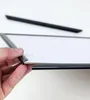 A hand is holding a silver picture frame, showing its edge and how it is constructed. Produktbild-Vorschau