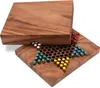 A wooden Chinese checkers board game with pieces. Produktbild-Vorschau