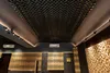 Interior view of a room with acoustic paneling on the ceiling and walls, featuring integrated lighting. Náhľad obrázku produktu