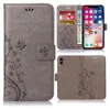 A collage of images showing a grey flip phone case with a floral pattern, designed for an Apple iPhone XR. The case is shown open and closed, with cards and cash inserted. Produktbild-Vorschau