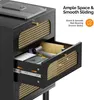 A close-up view of a black nightstand with rattan accents, showing an open drawer with a hairdryer and other items inside. The top surface has a phone on it. Text overlays highlight product features. Voir les images du produit