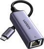 A close-up studio shot of a UGREEN USB-C to Ethernet adapter. Voir les images du produit