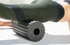 A person is using a Blackroll foam roller on their leg. Produktbild-Vorschau
