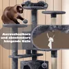 A cat playing on a multi-level cat tree with hanging toys. Produktbild-Vorschau