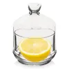 A clear glass jar with a lid, containing a slice of lemon. Náhled obrázku produktu