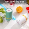 Two portable vacuum sealers with some food items like fruits and tomatoes. Produktbild-Vorschau