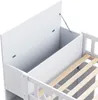 Close-up view of the interior of a white bunk bed with an open storage compartment and wooden slats for a mattress. Anteprima dell’immagine prodotto