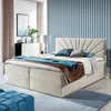 A bedroom scene with a bed, dresser, and decor. Voir les images du produit
