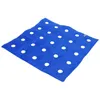 A blue inflatable cushion with white polka dots, lying flat on a white background. Náhľad obrázku produktu