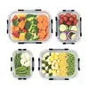 Four clear glass food storage containers filled with various chopped vegetables, arranged on a white background. Náhled obrázku produktu