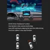 A car dashboard with a dashcam screen displaying a simulated road view, and graphics illustrating driver assistance functions. Below, a diagram shows cars on a road with warning indicators. Produktbild-Vorschau