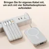 A power bank with integrated cables and a magnetic charging surface is shown connected to a power strip, with a second power bank nearby. Produktbild-Vorschau