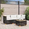 An outdoor patio scene with a black rattan sofa and coffee table set. Produktbild-Vorschau