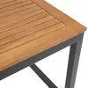 A close-up view of the corner of a wooden table with a dark metal frame. Produktbild-Vorschau