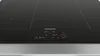 Close-up of a modern black induction hob with silver trim, showing digital controls. Náhľad obrázku produktu