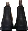 The back view of two brown leather Blundstone boots against a white background. Voir les images du produit